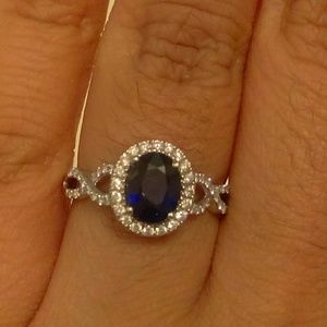 ReservedBlue sapphire and diamond white gold ring.